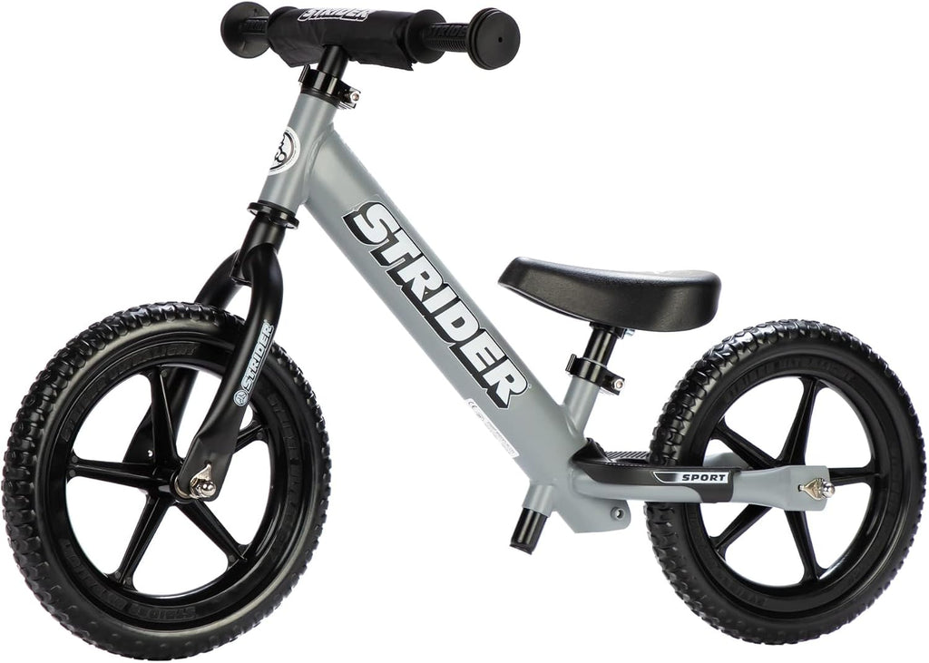 Strider 12' Sport Bike - No Pedal Balance Bicycle for Kids 1 to 4 Years - Includes Safety Pad, Padded Seat, Mini Grips & Flat-Free Tires - Tool-Free Assembly & Adjustments
