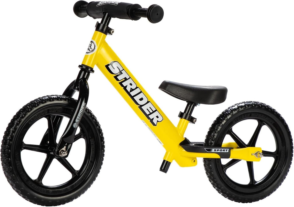Strider 12' Sport Bike - No Pedal Balance Bicycle for Kids 1 to 4 Years - Includes Safety Pad, Padded Seat, Mini Grips & Flat-Free Tires - Tool-Free Assembly & Adjustments