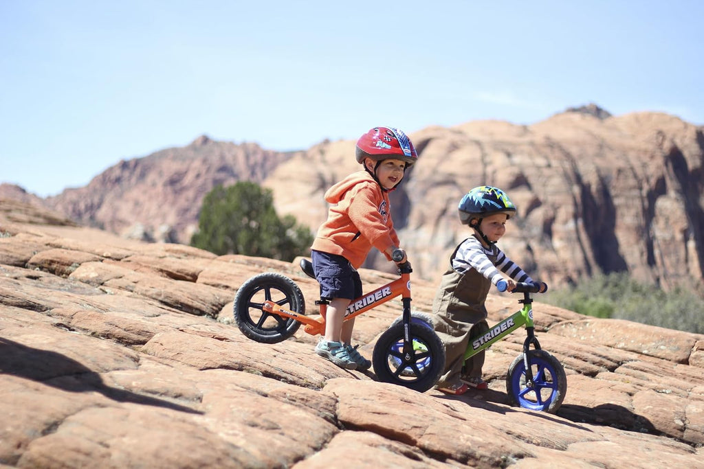 Strider 12' Sport Bike - No Pedal Balance Bicycle for Kids 1 to 4 Years - Includes Safety Pad, Padded Seat, Mini Grips & Flat-Free Tires - Tool-Free Assembly & Adjustments