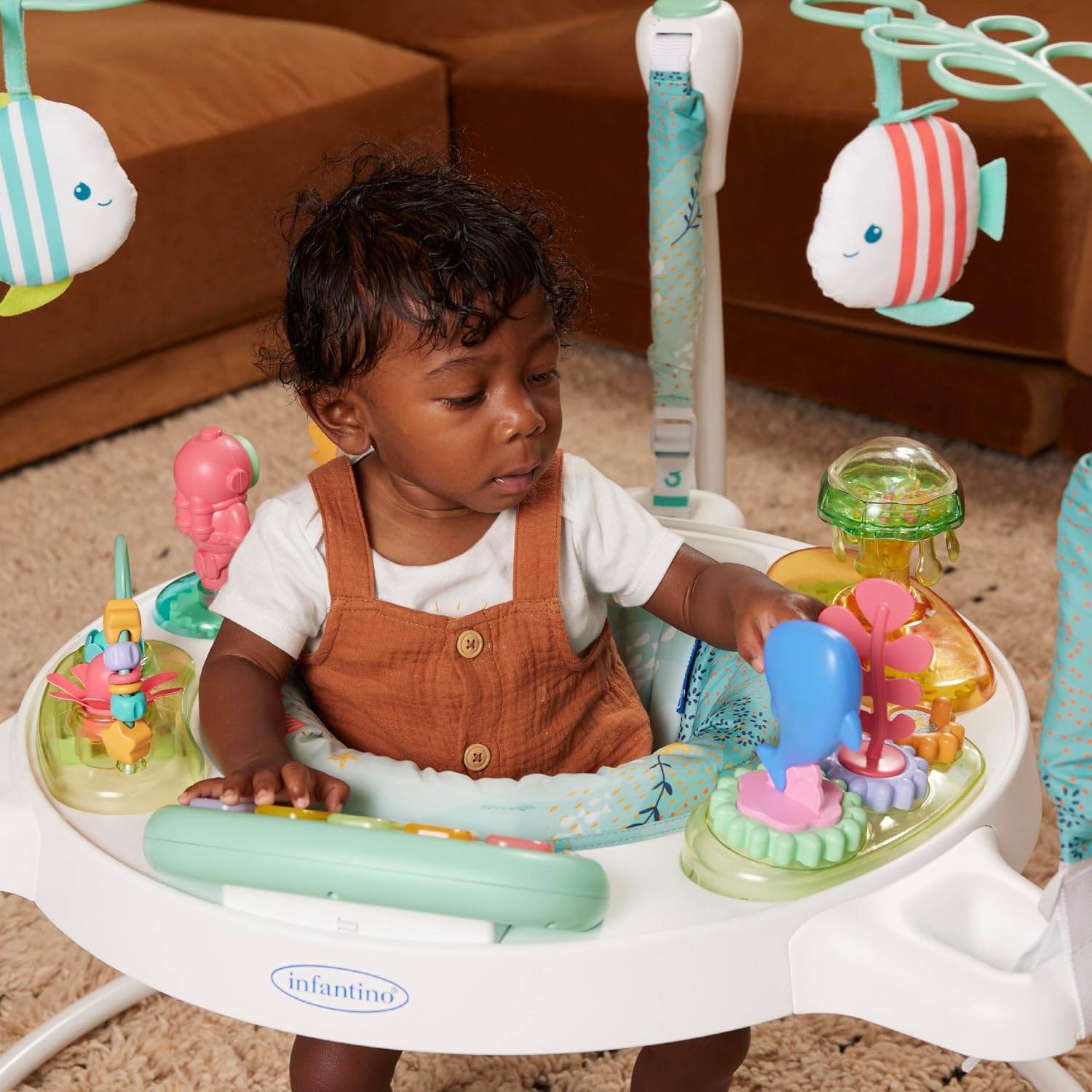 Infantino Magic Motion Activity Jumper, Under the Sea Baby Jumper with 360° Seat, Removable Piano, Lights & Music, Adjustable Height Activity Center, Motor Skills and Sensory Play, Ages 4+ Months
