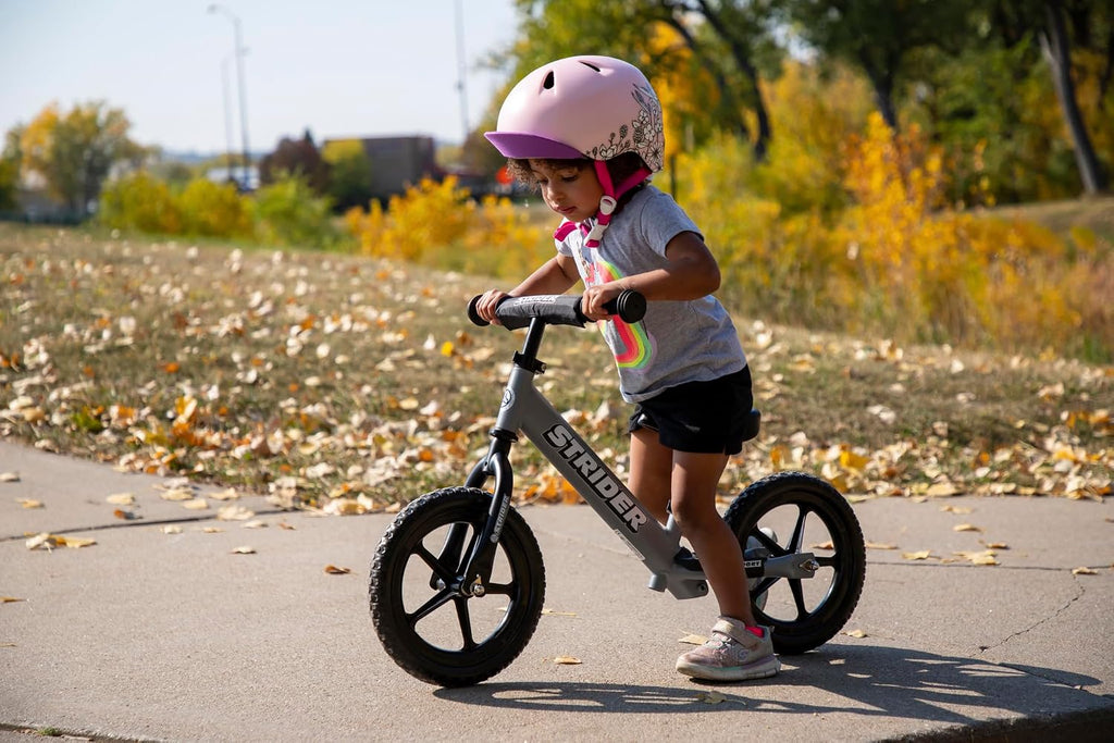 Strider 12' Sport Bike - No Pedal Balance Bicycle for Kids 1 to 4 Years - Includes Safety Pad, Padded Seat, Mini Grips & Flat-Free Tires - Tool-Free Assembly & Adjustments