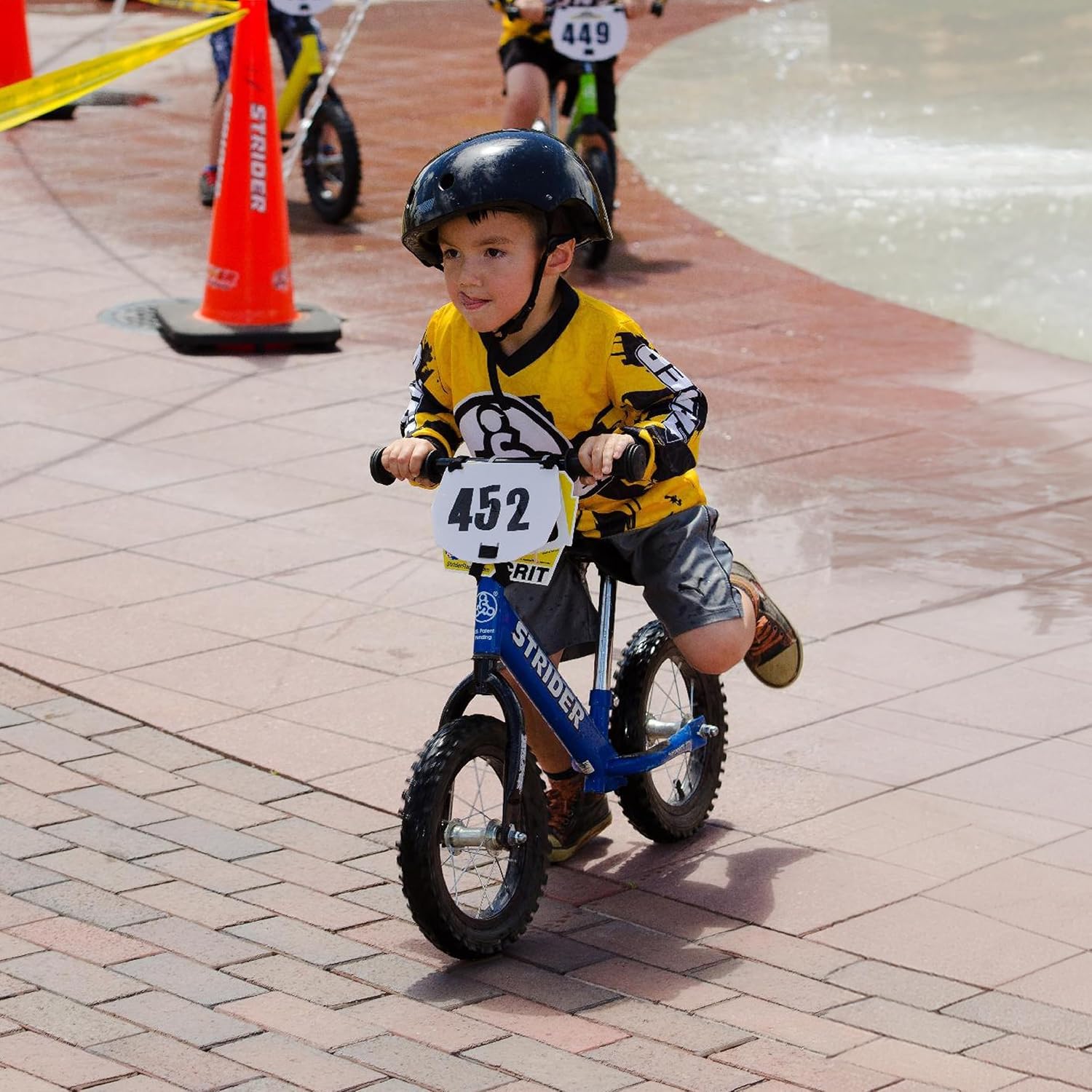 Strider 12' Sport Bike - No Pedal Balance Bicycle for Kids 1 to 4 Years - Includes Safety Pad, Padded Seat, Mini Grips & Flat-Free Tires - Tool-Free Assembly & Adjustments