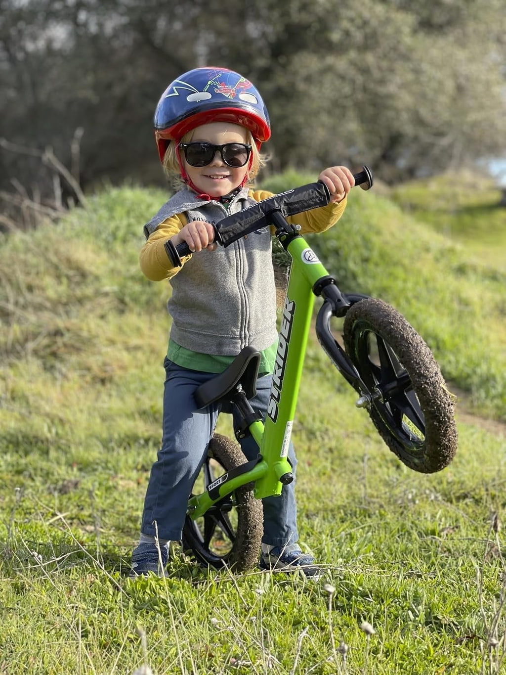 Strider 12' Sport Bike - No Pedal Balance Bicycle for Kids 1 to 4 Years - Includes Safety Pad, Padded Seat, Mini Grips & Flat-Free Tires - Tool-Free Assembly & Adjustments