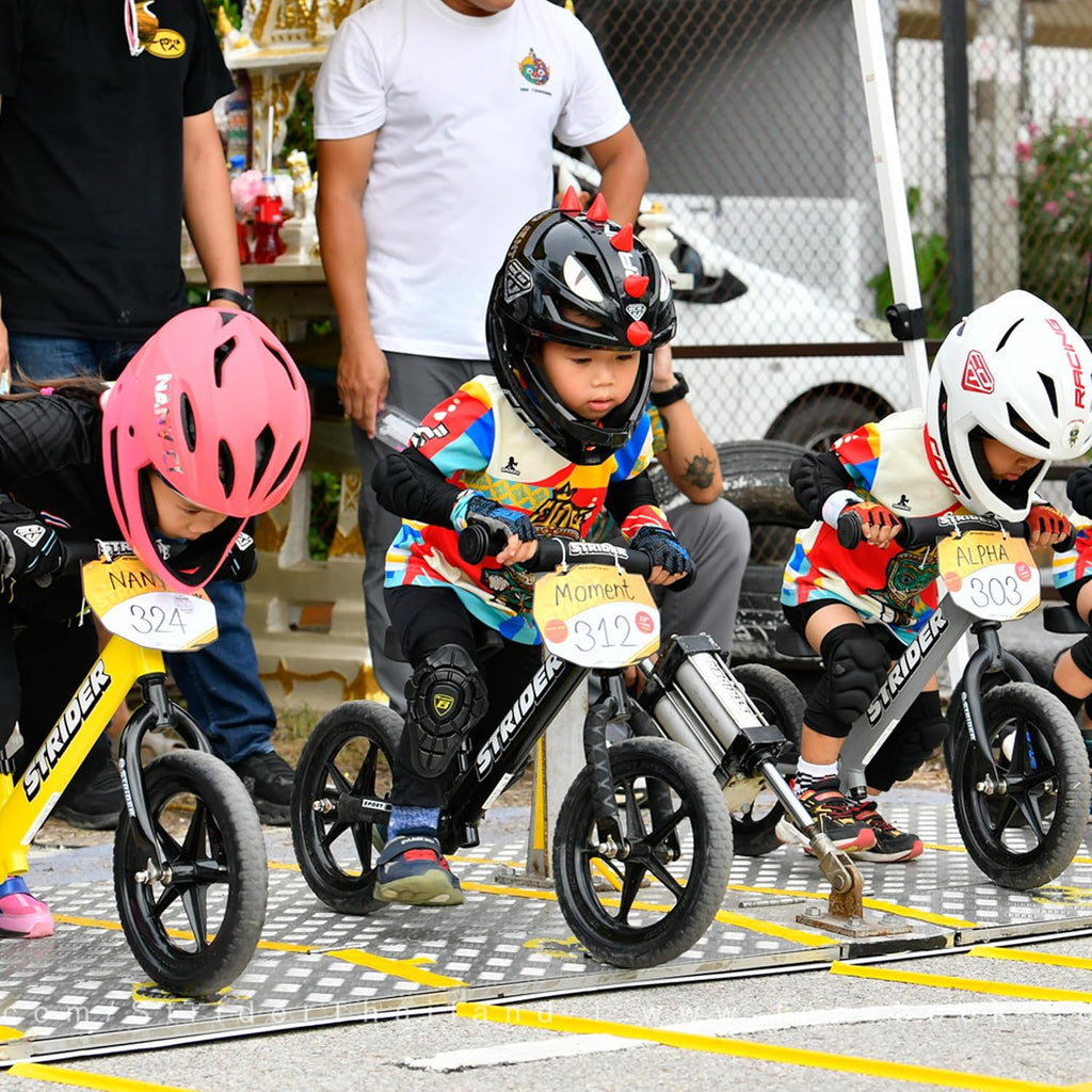 Strider 12' Sport Bike - No Pedal Balance Bicycle for Kids 1 to 4 Years - Includes Safety Pad, Padded Seat, Mini Grips & Flat-Free Tires - Tool-Free Assembly & Adjustments